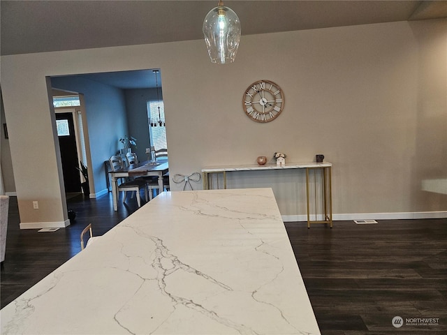 dining room featuring dark wood-type flooring