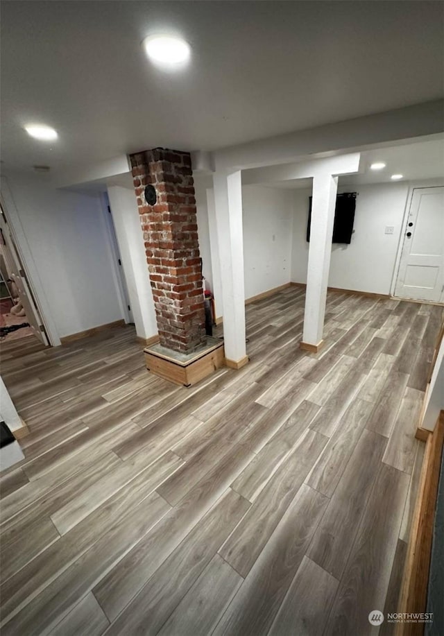 basement with wood-type flooring