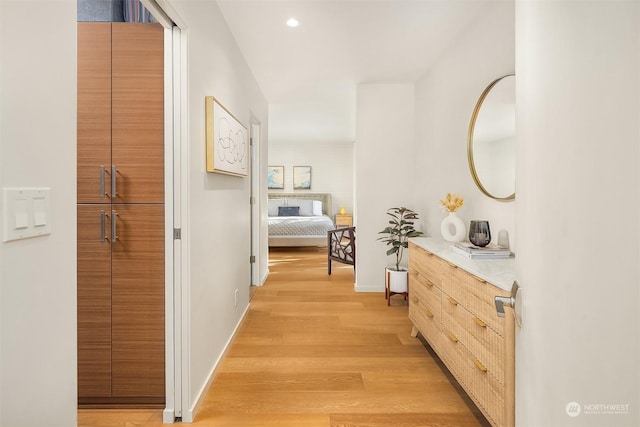 hallway featuring light hardwood / wood-style flooring