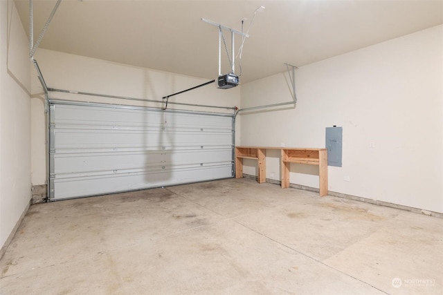 garage with a garage door opener and electric panel