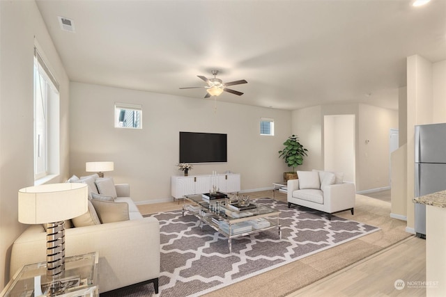 living room featuring ceiling fan