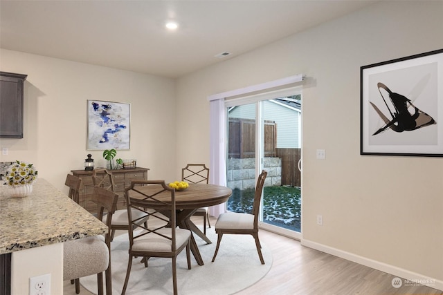 dining space featuring light hardwood / wood-style floors