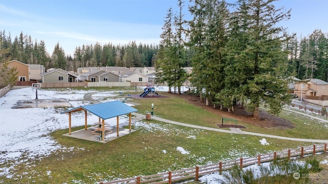 view of dock featuring a playground and a lawn