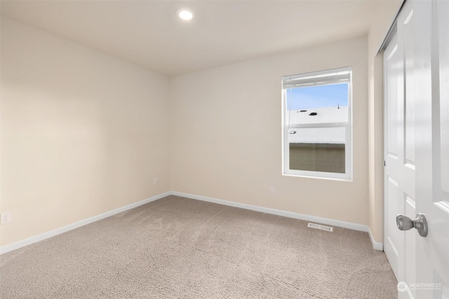 spare room featuring carpet floors