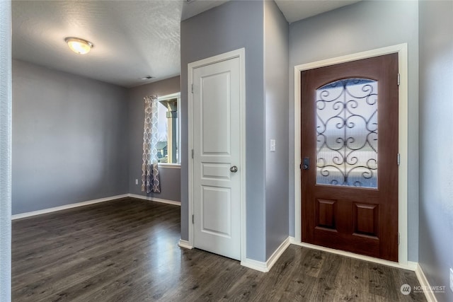 foyer with dark hardwood / wood-style flooring