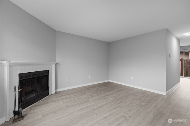 unfurnished living room featuring light hardwood / wood-style flooring