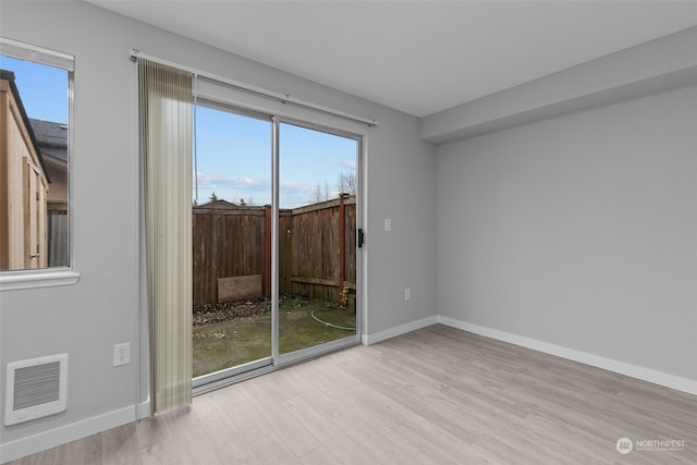 unfurnished room featuring light hardwood / wood-style flooring