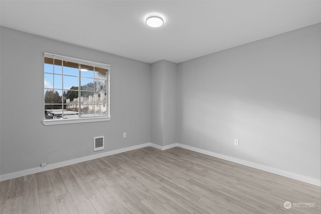 unfurnished room featuring light wood-type flooring