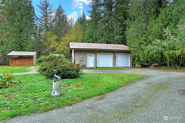 garage featuring a lawn