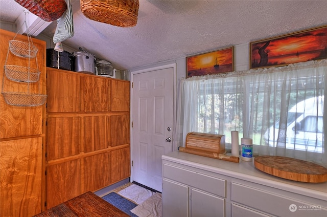 interior space featuring a textured ceiling