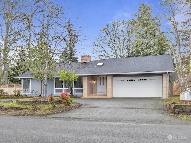 single story home featuring a garage