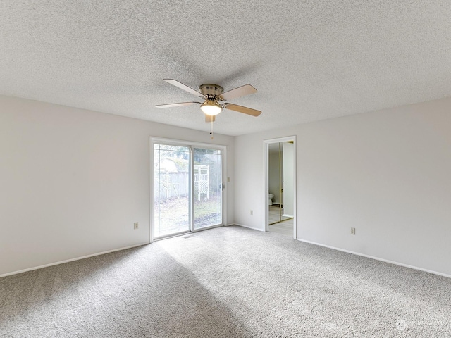 unfurnished room with ceiling fan, carpet floors, and a textured ceiling