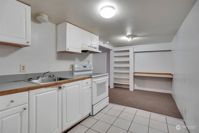 kitchen featuring white electric stove, white cabinetry, sink, light colored carpet, and a textured ceiling