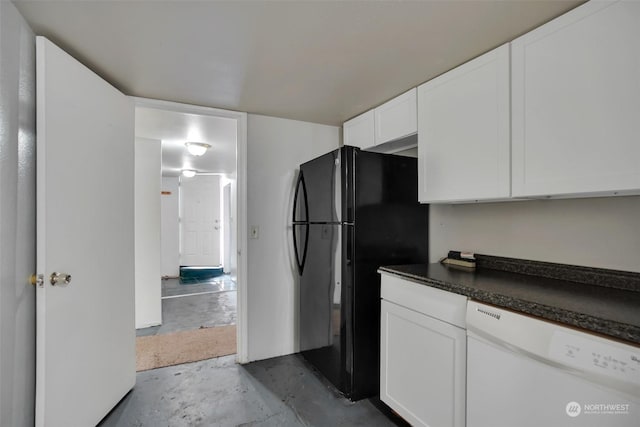 kitchen featuring white cabinets, concrete floors, dishwasher, and black fridge