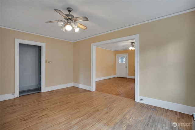 empty room featuring crown molding, ceiling fan, and light wood-type flooring