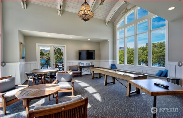 living room featuring plenty of natural light, high vaulted ceiling, wood ceiling, and beam ceiling