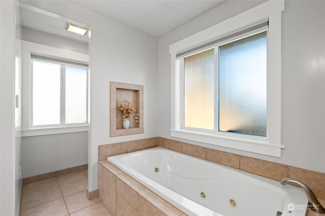 bathroom featuring a relaxing tiled tub and tile patterned floors