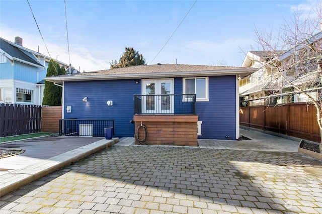 back of property featuring french doors and a patio area