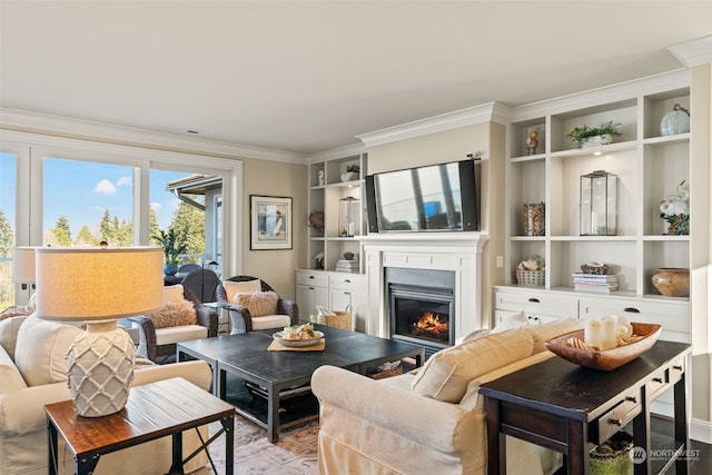 living room with crown molding and built in shelves