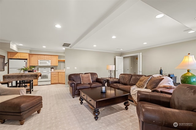 living room with ornamental molding and light carpet