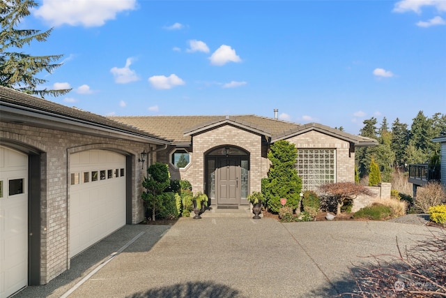 single story home featuring a garage