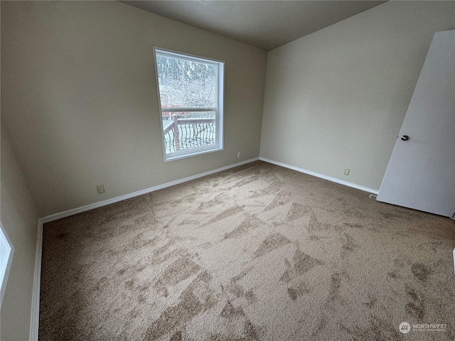 spare room with light carpet