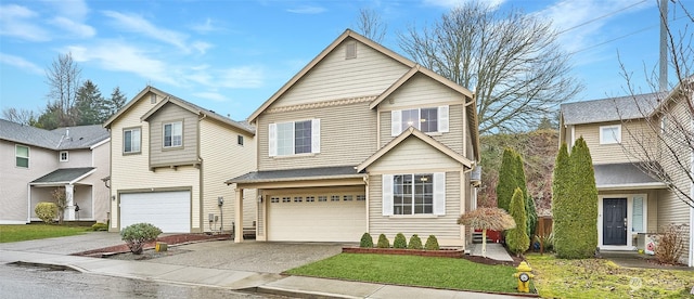 view of front property with a garage and a front lawn