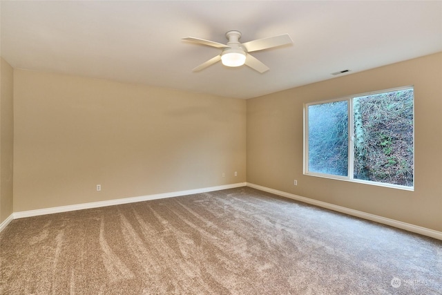 unfurnished room with carpet floors and ceiling fan