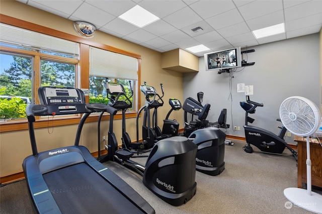 gym featuring a paneled ceiling