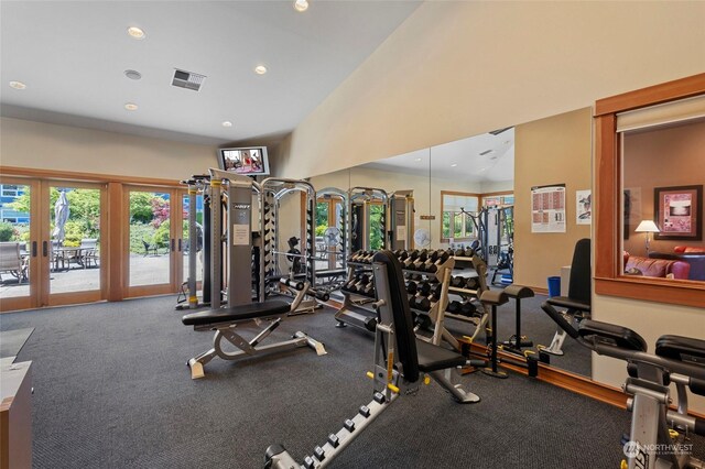 workout area with high vaulted ceiling and french doors