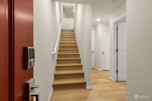 staircase featuring hardwood / wood-style floors