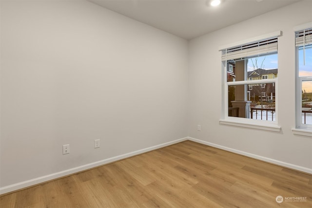 empty room with light hardwood / wood-style floors