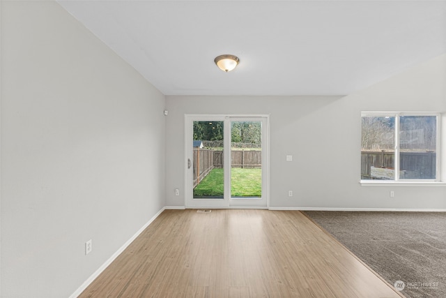 unfurnished room featuring light hardwood / wood-style floors