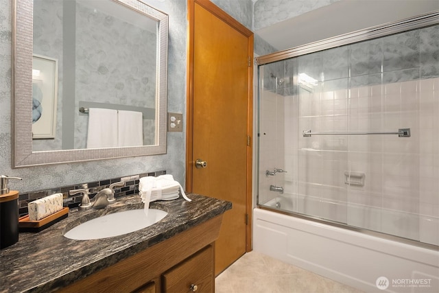 full bathroom with enclosed tub / shower combo and vanity