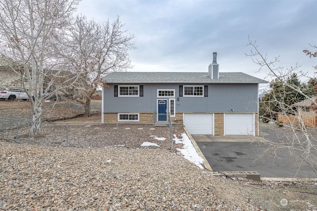 raised ranch with a garage