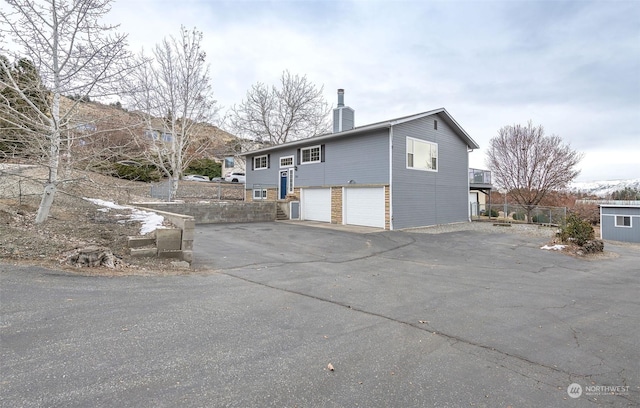 view of side of property featuring a garage