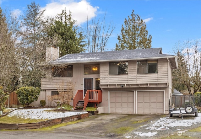 split foyer home featuring a garage