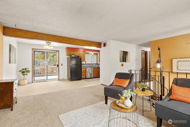 carpeted living room featuring a textured ceiling