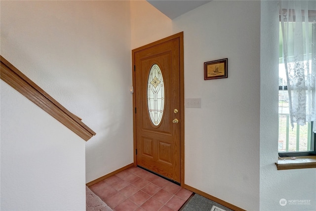 foyer with light tile patterned floors