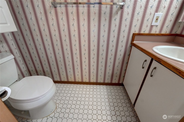 bathroom with vanity and toilet