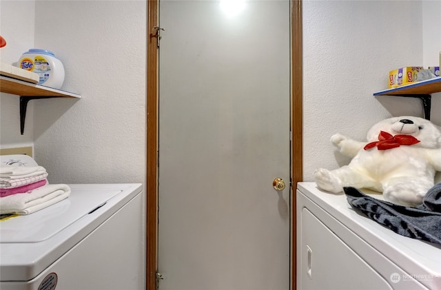 laundry area with independent washer and dryer