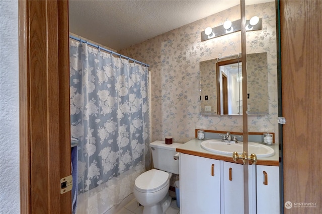 bathroom featuring tile patterned flooring, vanity, a textured ceiling, curtained shower, and toilet