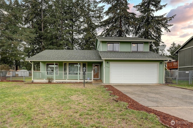 view of front of property featuring a garage, covered porch, and a lawn