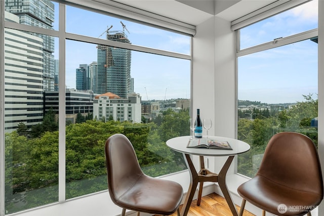 sunroom / solarium featuring a view of city