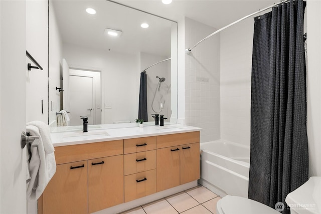 bathroom with double vanity, shower / tub combo, toilet, tile patterned floors, and a sink