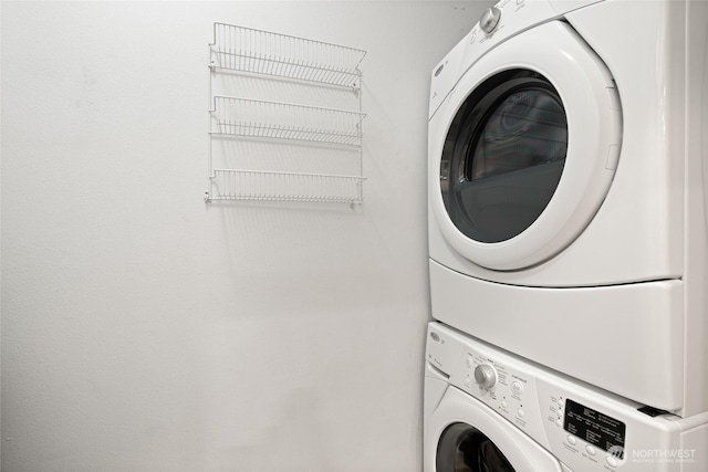 washroom with laundry area and stacked washer and clothes dryer