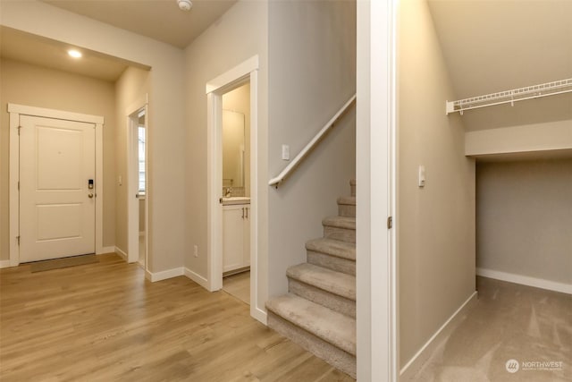 stairs with hardwood / wood-style flooring