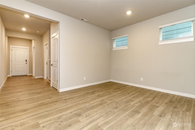 spare room featuring light hardwood / wood-style floors