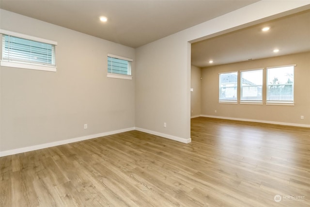 empty room with light hardwood / wood-style floors