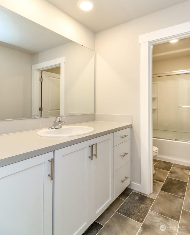 full bathroom with vanity, bathtub / shower combination, and toilet